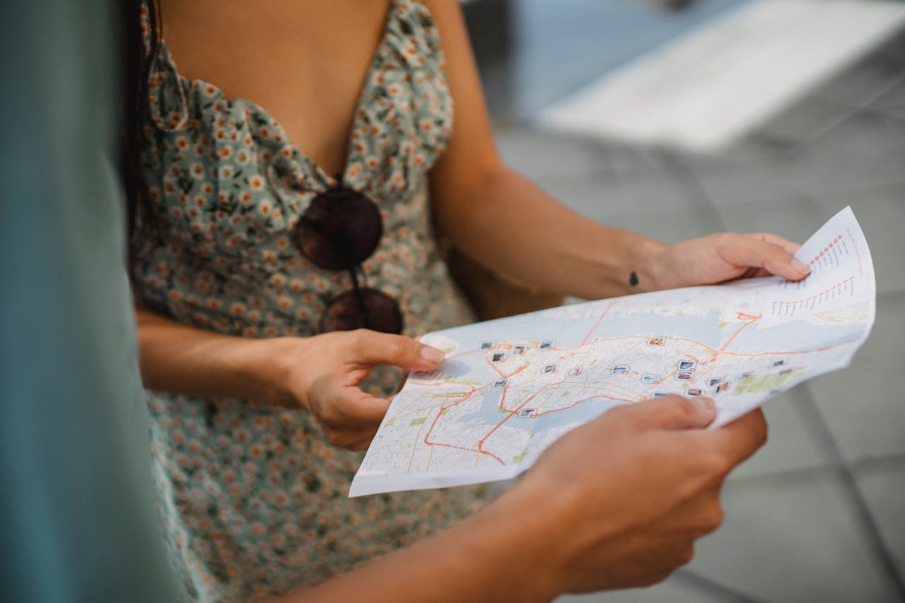 The Art of Drawing Readers In: Your attractive post title goes here Crop anonymous couple travelers in summer clothes checking location in paper map while walking in unknown city